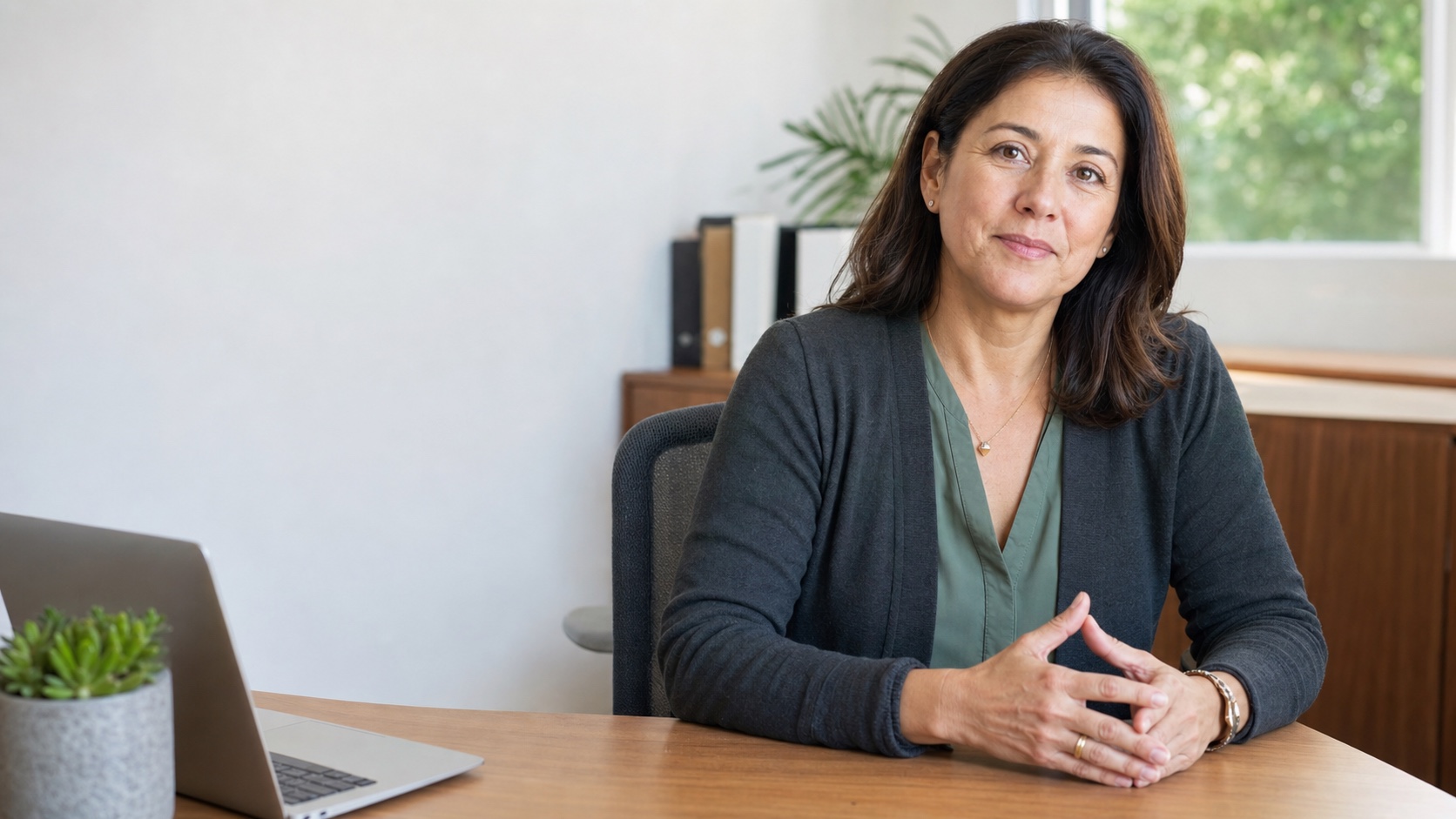 An HR advisor seated in a bright office